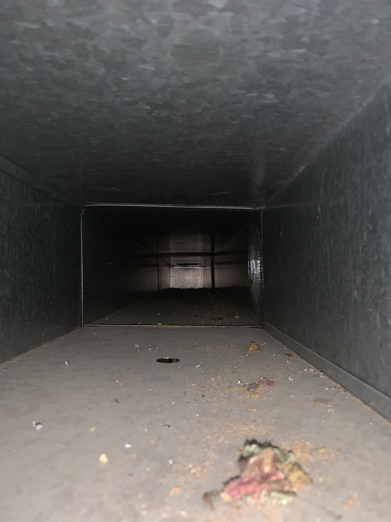 Before HVAC cleaning showing debris and buildup inside air ducts in Novi, Michigan